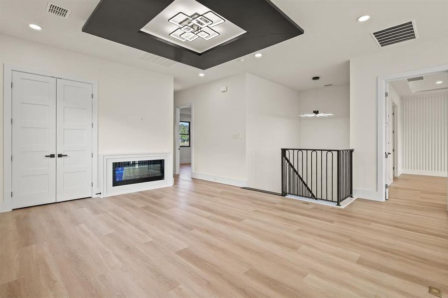 Unfurnished living room featuring light hardwood / wood-style flooring