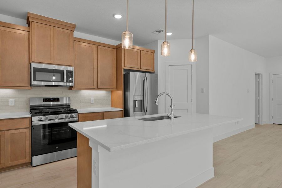Furnished interior view inside a new home in Meridiana, Iowa Colony (Image 6).