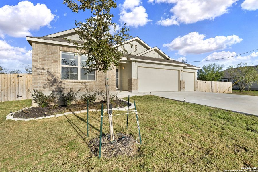 Front exterior of a new home in Chaparral Ranch, Floresville, TX, highlighting curb appeal (Image 18).