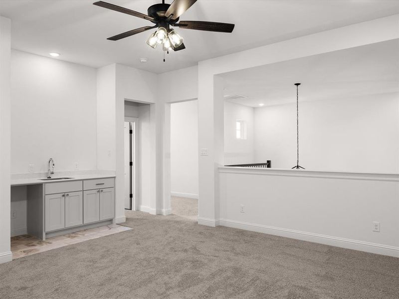 Unfurnished living room featuring recessed lighting, light carpet, and ceiling fan