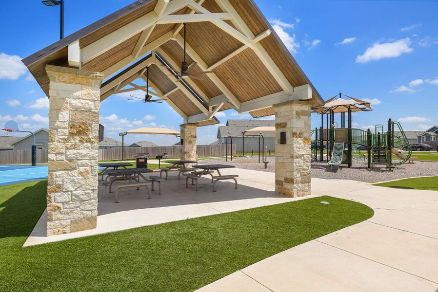 Covered pavilion with picnic seating for gatherings. Covered pavilion with picnic seating for gatherings.