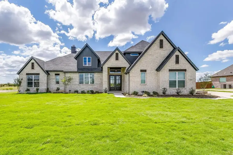 Representative exterior photo of a completed home built from the The Carter by Elmwood Custom Homes in Ranch at Stone Hill, Waxahachie, TX (Image 2).