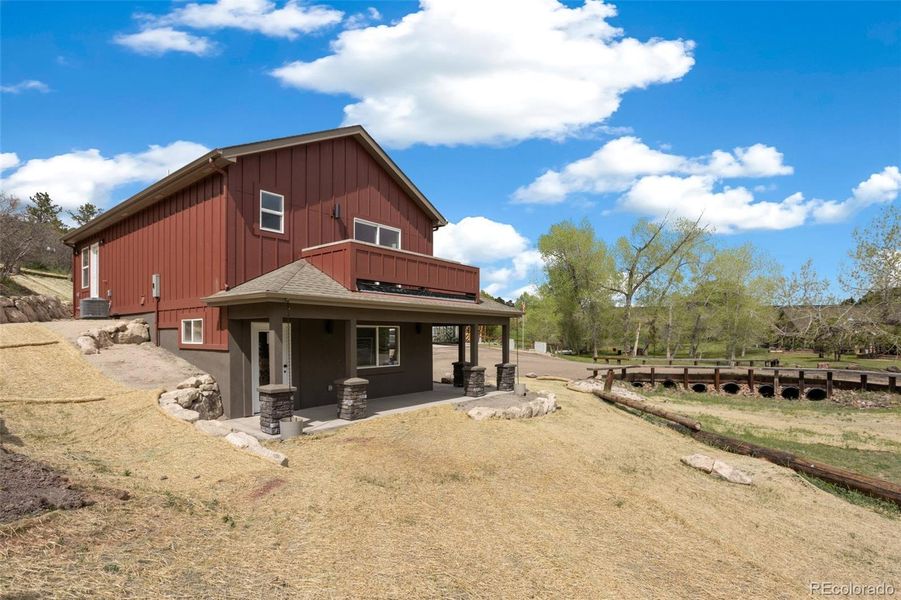 Wonderful side yard & private back patio with stone retaining wall Wonderful side yard & private back patio with stone retaining wall