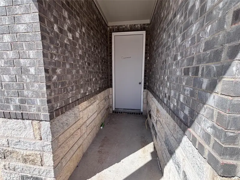 Exterior details and patio area of a home in The Colony, Bastrop (Image 3).