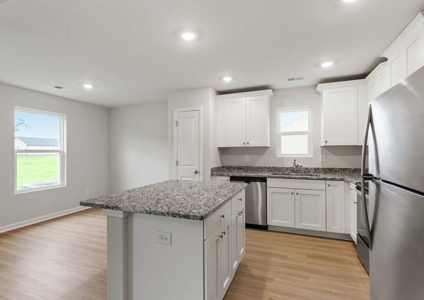 The kitchen comes with designer wood cabinetry