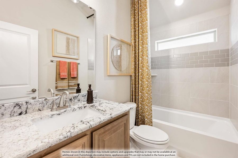 Bathroom with granite vanity, wood cabinets, tiled tub-shower combo, and small window above the tub