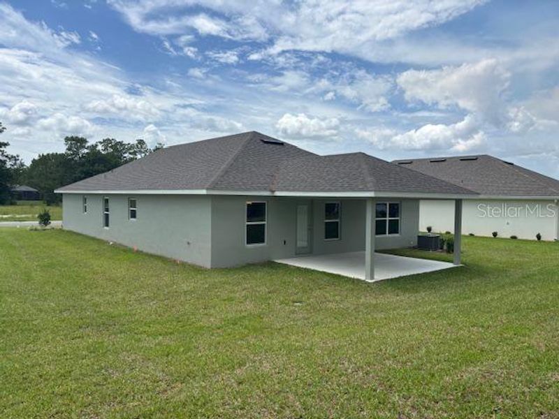 Front exterior of a new home in Juliette Falls, Dunnellon, FL, highlighting curb appeal (Image 6). Front exterior of a new home in Juliette Falls, Dunnellon, FL, highlighting curb appeal (Image 6).