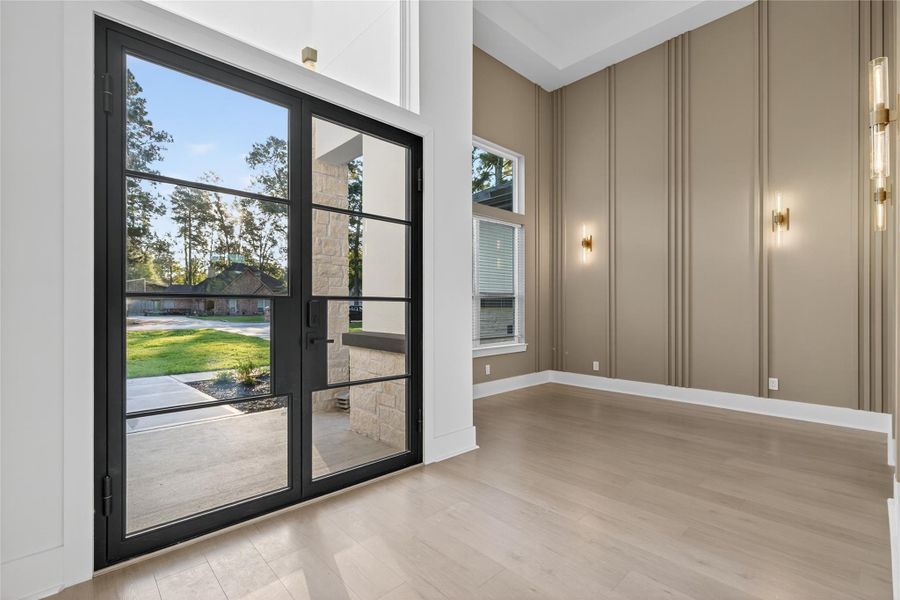 Open living space is enhanced by recessed lighting, tray ceiling details, and abundant natural light. **Images are from a previously completed project. **