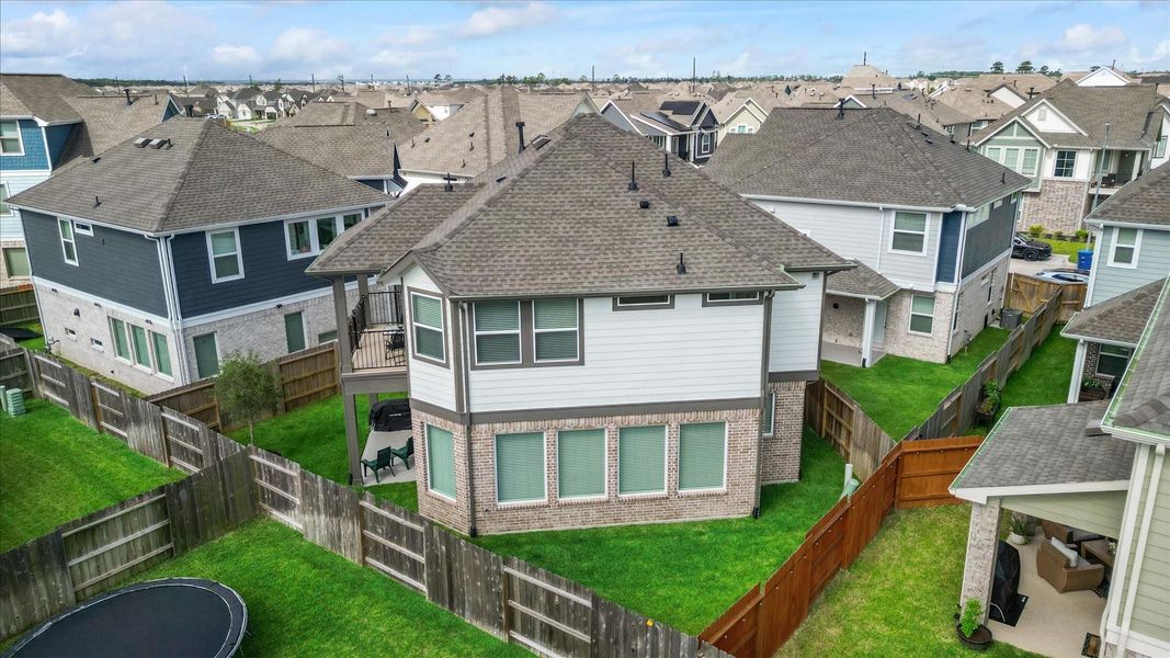 Exterior details and patio area of a home in Balmoral, Humble (Image 25).