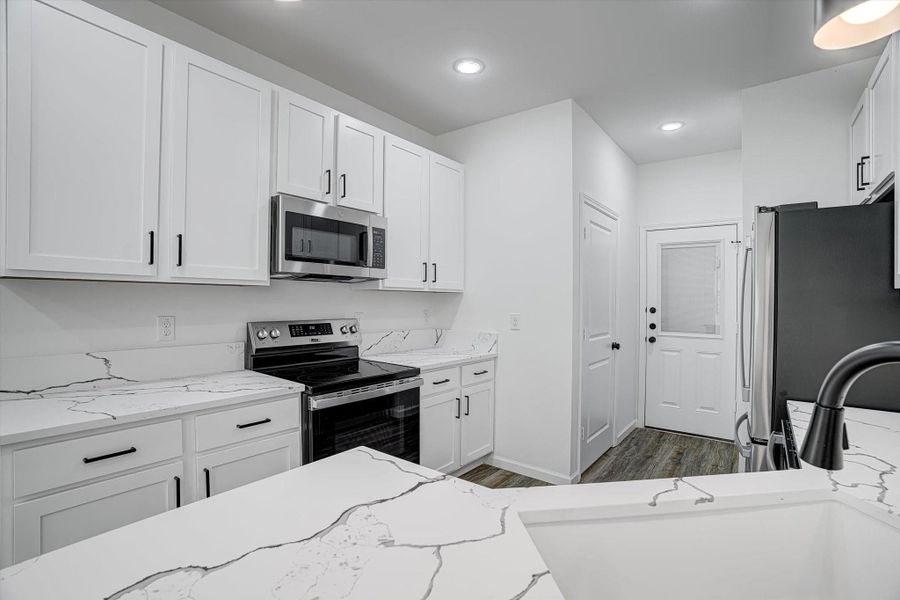 Furnished interior view inside a new home in , Kenefick (Image 14).