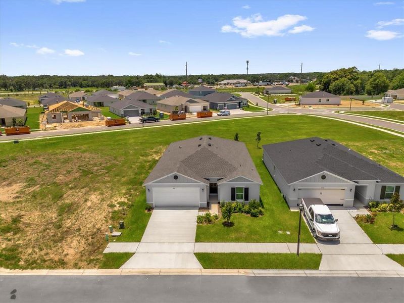Front exterior of a new home in Hancock Crossings, Bartow, FL, highlighting curb appeal (Image 1).
