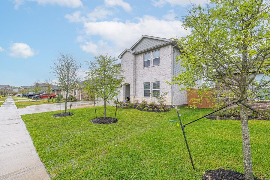 Front exterior of a new home in River Ranch Meadows, Dayton, TX, highlighting curb appeal (Image 22). Front exterior of a new home in River Ranch Meadows, Dayton, TX, highlighting curb appeal (Image 22).