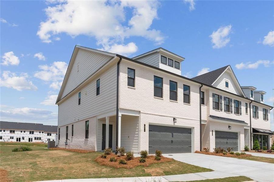 Front exterior of a new home in Magnolia Square, Austell, GA, highlighting curb appeal (Image 19). Front exterior of a new home in Magnolia Square, Austell, GA, highlighting curb appeal (Image 19).