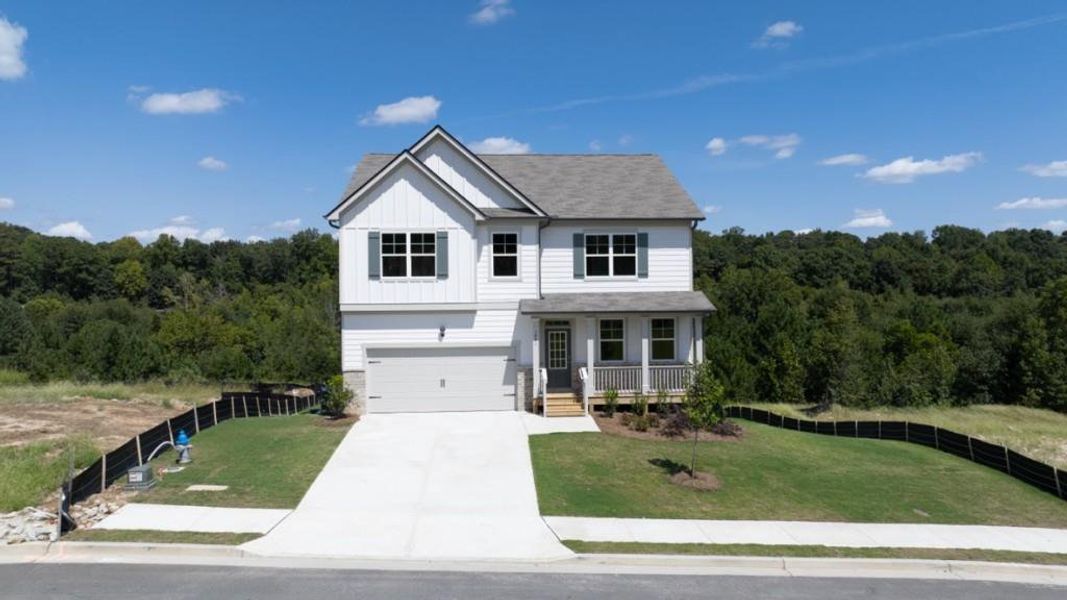 Front exterior of a new home in Liberty Crossing, Braselton, GA, highlighting curb appeal (Image 2).