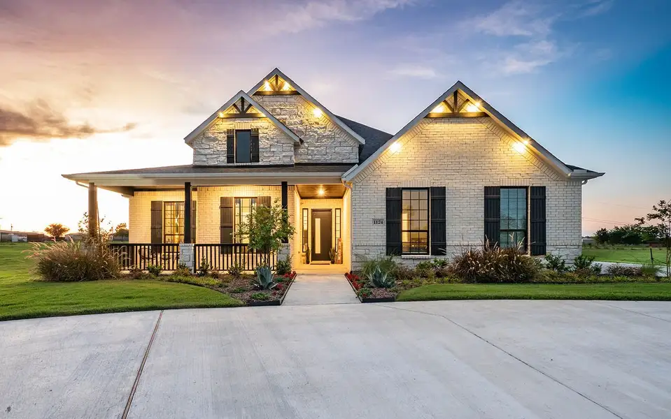 Front exterior of a new home in Marvida, Cypress, TX, highlighting curb appeal (Image 2).