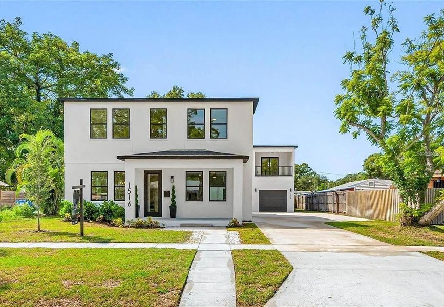 Front exterior of a new home in , St. Petersburg, FL, highlighting curb appeal (Image 1). Front exterior of a new home in , St. Petersburg, FL, highlighting curb appeal (Image 1).