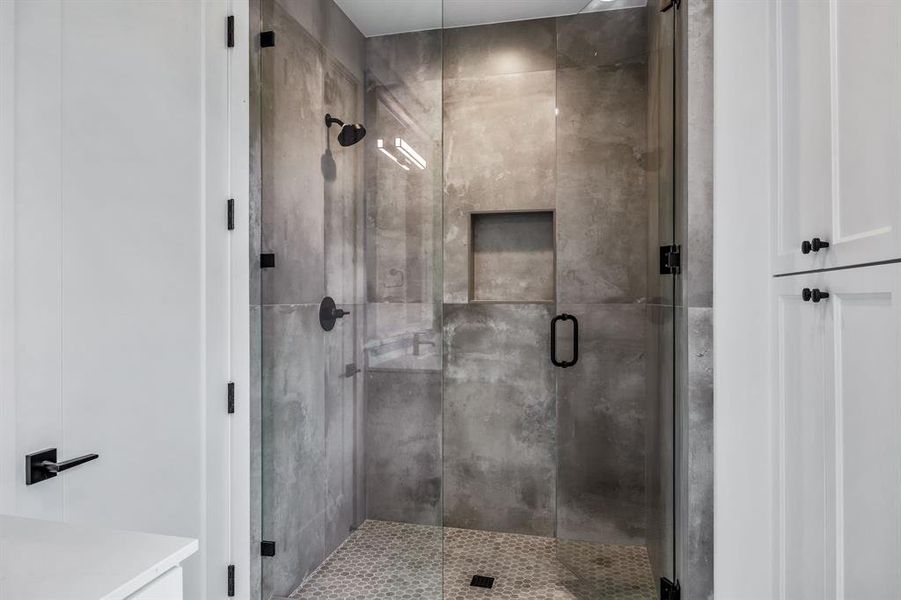 Bathroom featuring walk in shower