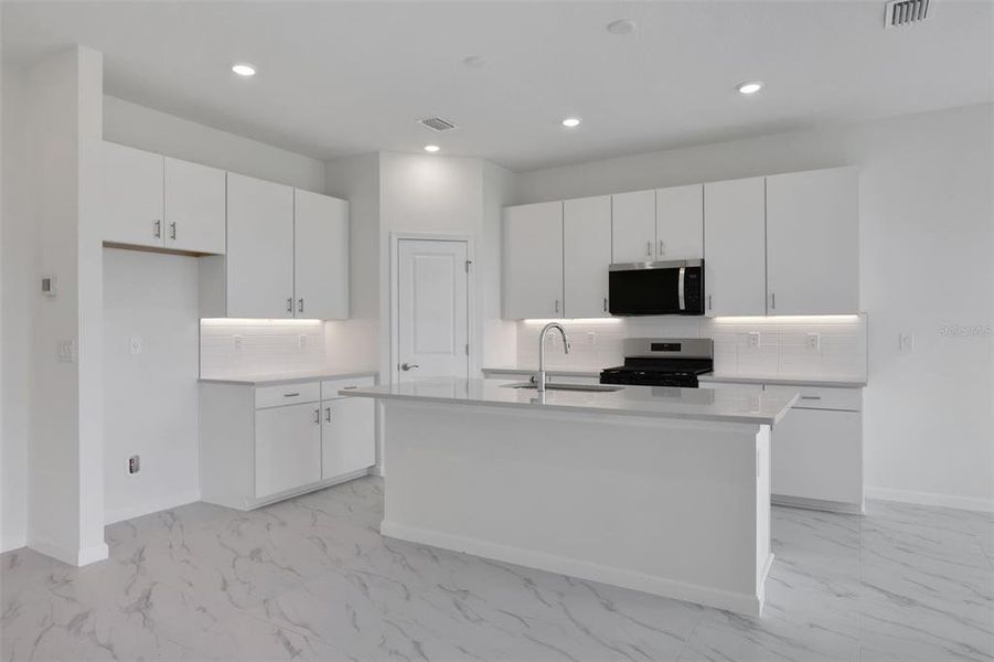 Furnished interior view inside a new home in Brystol North at Wylder, Port St. Lucie (Image 6).