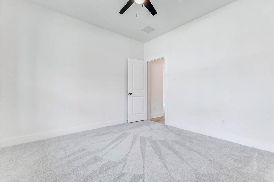 Second Bedroom Features upgraded plush carpet, soft pad, and modern ceiling fan. Bright and comfortable — perfect for guests or family. Nice walk-in closet. Second Bedroom Features upgraded plush carpet, soft pad, and modern ceiling fan. Bright and comfortable — perfect for guests or family. Nice walk-in closet.