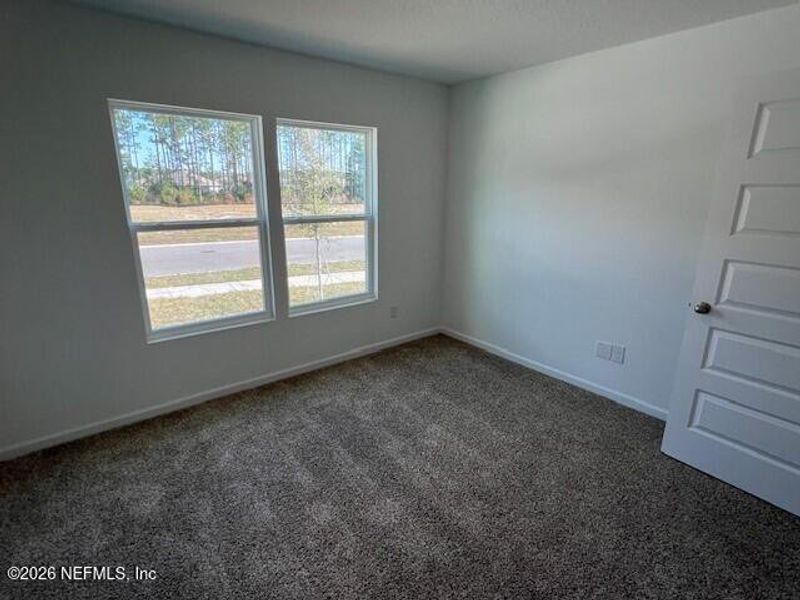 Spacious, unfurnished interior of a new home in Sawmill Branch, Palm Coast (Image 24).