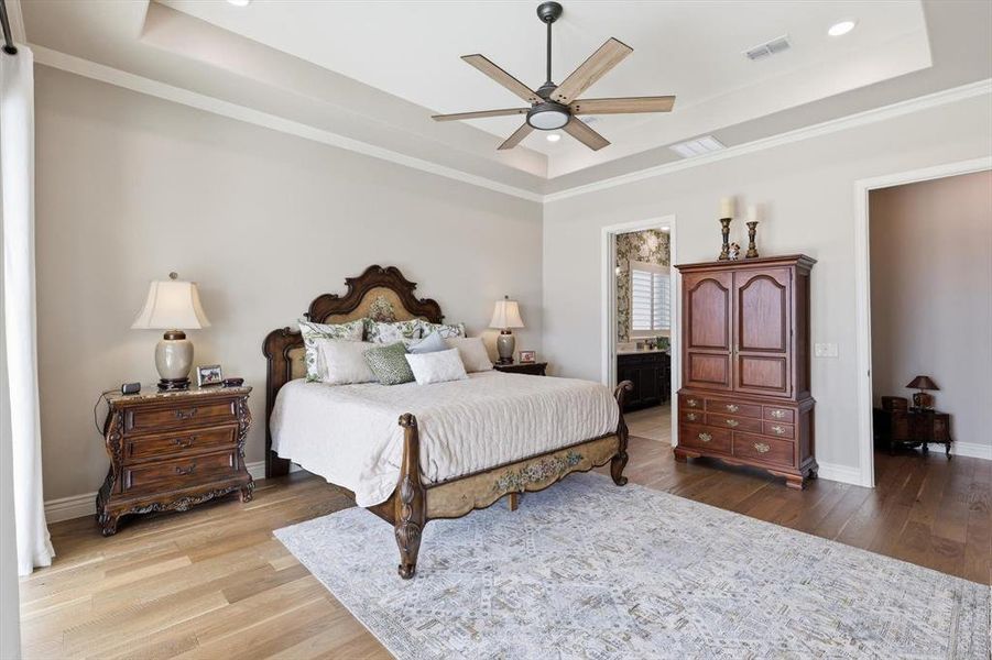 The Primary Suite is a Magnificent Private Sanctuary positioned to Capture Sweeping Fairway Views with a Dramatic Wall of Three-Panel Sliding Glass that opens to the Outdoor Pavilion. Grand in Scale yet Serene in Ambiance, this Luxurious Retreat offers a True Sense of Escape within the Home and Enjoys a Luxurious En-Suite Bath.