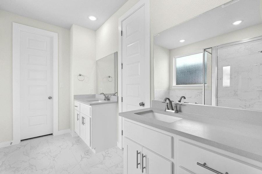 Full bath featuring light marble finish floors, two vanities, a marble finish shower, and recessed lighting