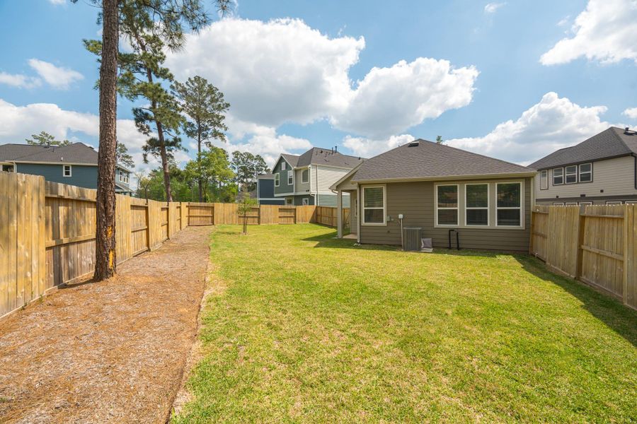 Exterior details and patio area of a home in The Woodlands Hills, Willis (Image 22).