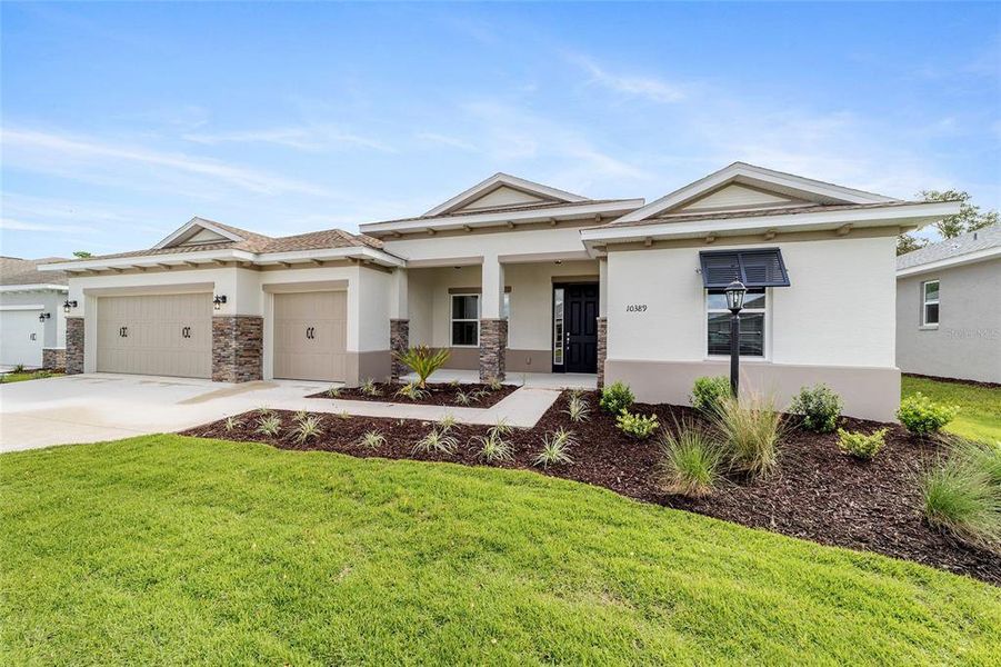 Front exterior of a new home in On Top of the World Communities, Ocala, FL, highlighting curb appeal (Image 25).