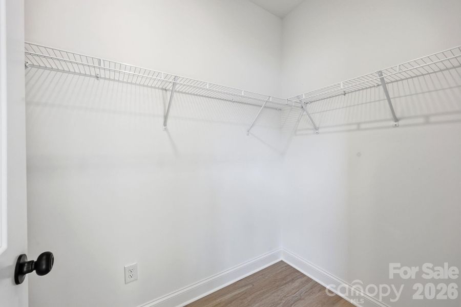 Primary walk-in closet Primary walk-in closet