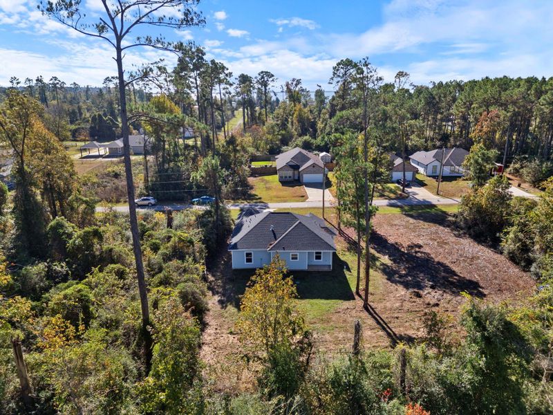 With plenty of open yard space and nature right at your doorstep, this home provides a serene outdoor environment perfect for relaxation or future landscaping opportunities.