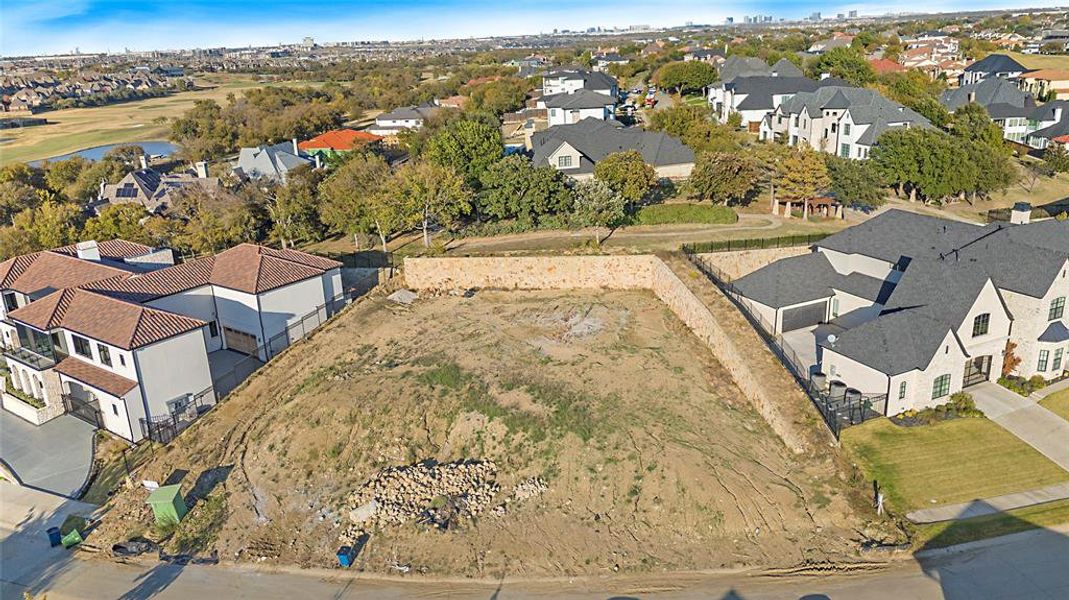 Aerial overview of property's location with nearby suburban area and a nearby body of water
