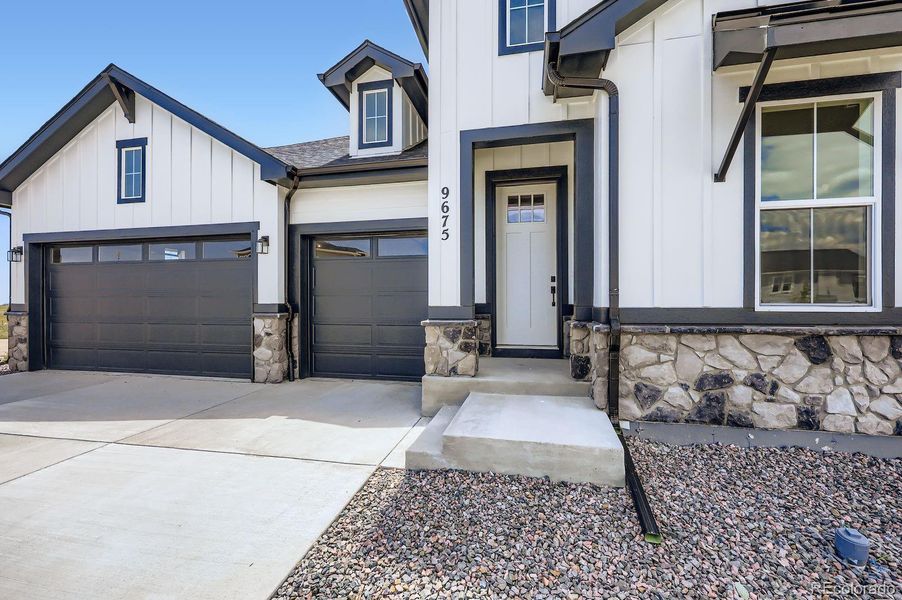 Front exterior of a new home in Timber Ridge, Colorado Springs, CO, highlighting curb appeal (Image 19).