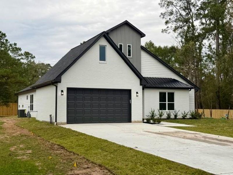 Front exterior of a new home in , Magnolia, TX, highlighting curb appeal (Image 1). Front exterior of a new home in , Magnolia, TX, highlighting curb appeal (Image 1).