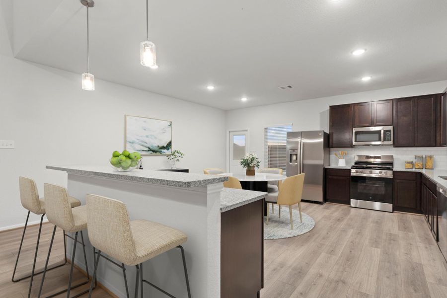A virtually staged view of the kitchen highlights the spacious island with bar seating and pendant lighting above. The open layout connects seamlessly to the dining and family areas, creating an ideal setup for entertaining and family gatherings.  Notice the stunning granite countertops!