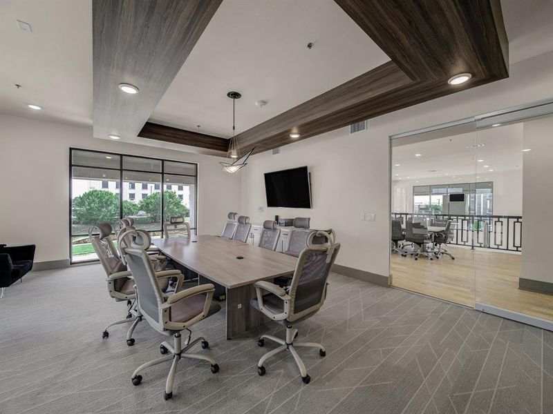 Carpeted office featuring a tray ceiling and recessed lighting Carpeted office featuring a tray ceiling and recessed lighting