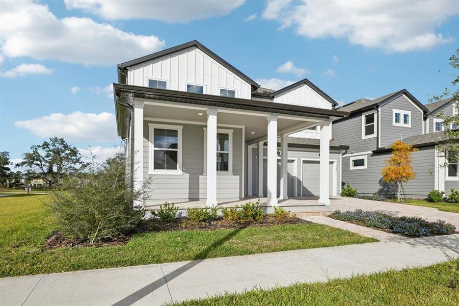 Front exterior of a new home in Northlake Traditional, Winter Garden, FL, highlighting curb appeal (Image 2). Front exterior of a new home in Northlake Traditional, Winter Garden, FL, highlighting curb appeal (Image 2).