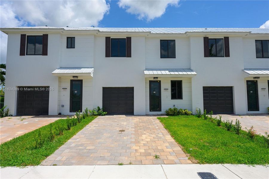 Front exterior of a new home in , Florida City, FL, highlighting curb appeal (Image 18).