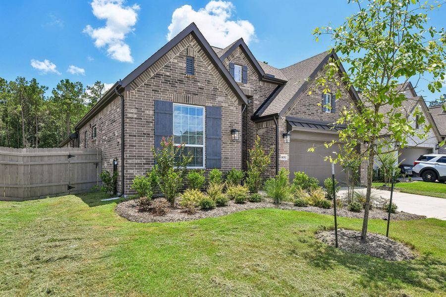 Front exterior of a new home in Artavia, Conroe, TX, highlighting curb appeal (Image 21). Front exterior of a new home in Artavia, Conroe, TX, highlighting curb appeal (Image 21).