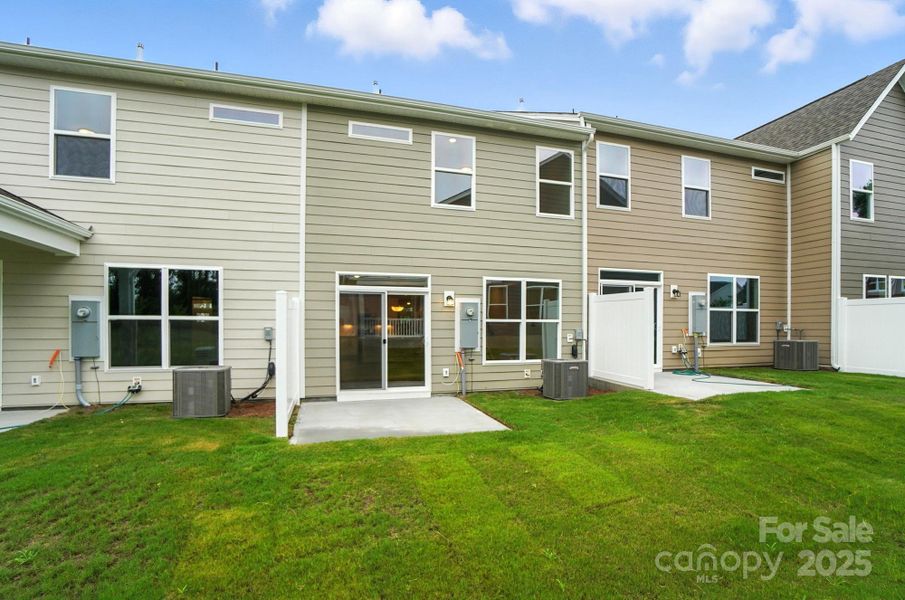 Front exterior of a new home in Harrisburg Village Townhomes, Harrisburg, NC, highlighting curb appeal (Image 27). Front exterior of a new home in Harrisburg Village Townhomes, Harrisburg, NC, highlighting curb appeal (Image 27).