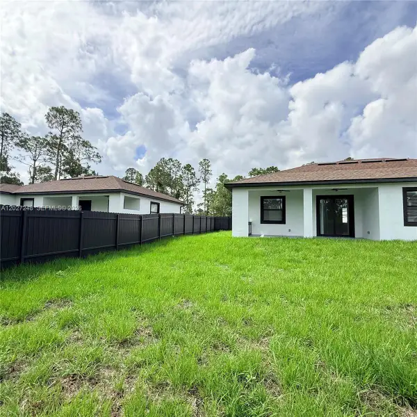 Exterior details and patio area of a home in , Lehigh Acres (Image 4).