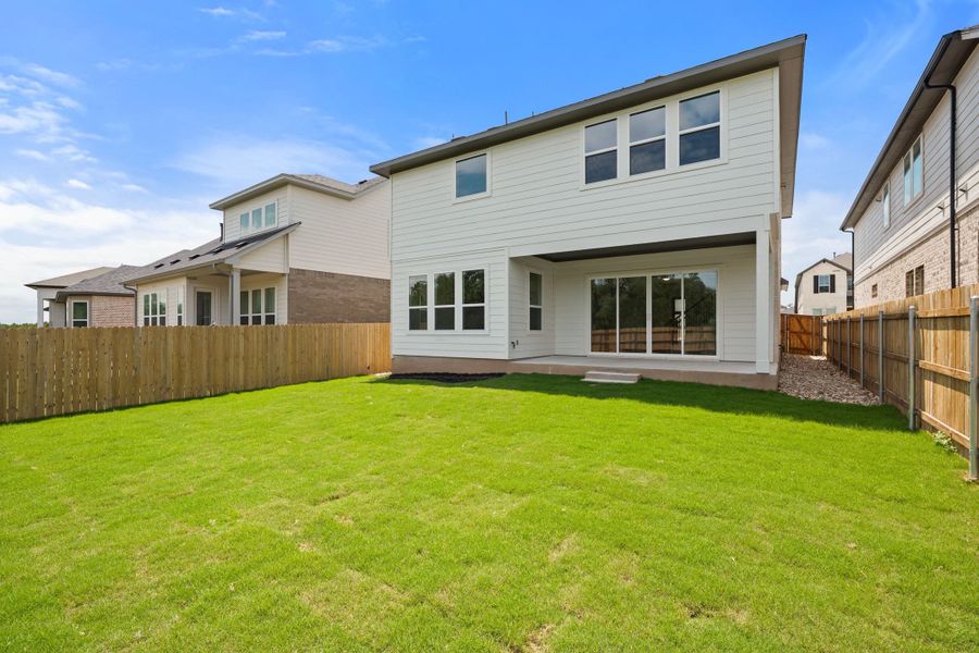 Exterior details and patio area of a home in Heritage, Dripping Springs (Image 34).