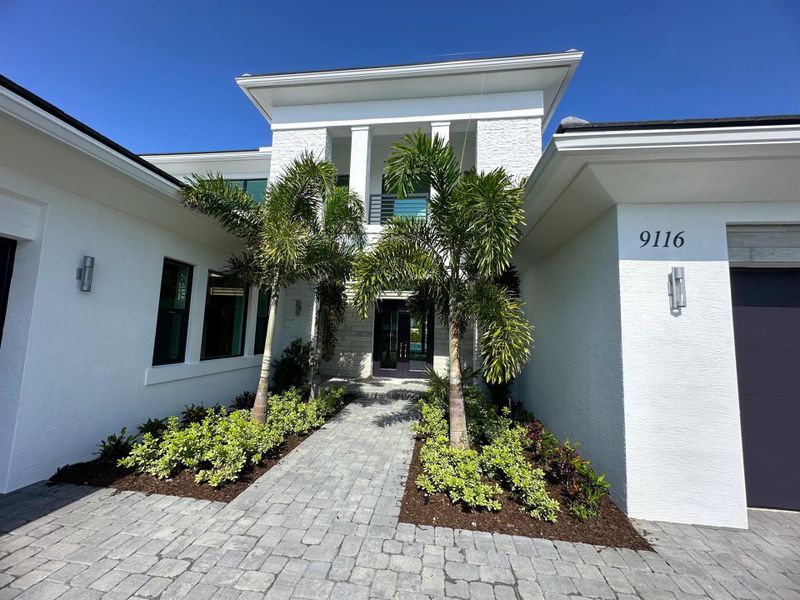 Exterior details and patio area of a home in Coral Isles at Avenir, Palm Beach Gardens (Image 3).