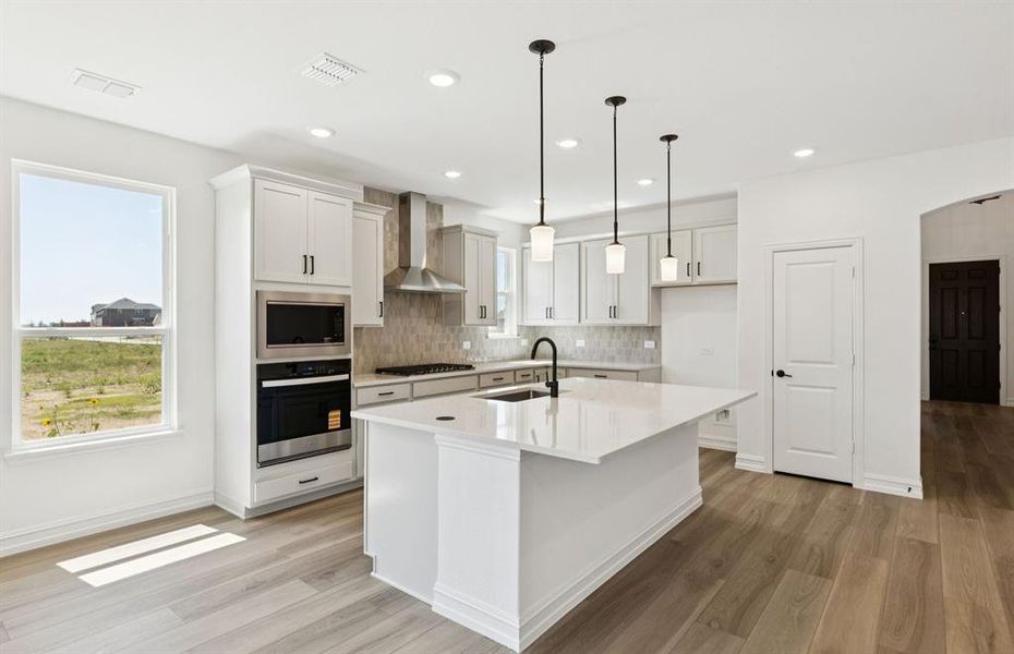 Spacious kitchen with eat-in bar top island Spacious kitchen with eat-in bar top island