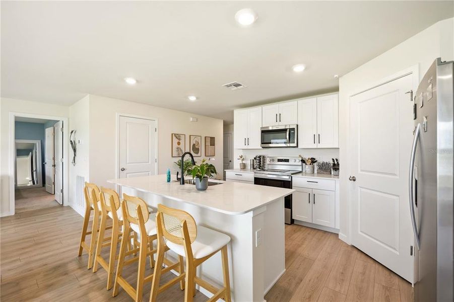 Furnished interior view inside a new home in Central Parc, North Port (Image 26).