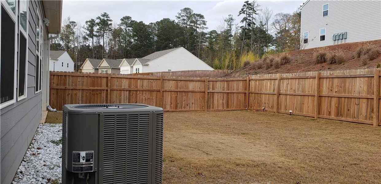 Exterior details and patio area of a home in Greyson Parc, Locust Grove (Image 4).