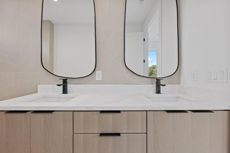 Full bathroom featuring double vanity Full bathroom featuring double vanity