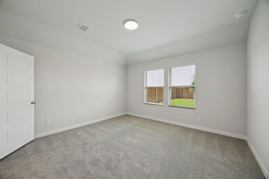 Primary Suite in the Hadley home plan by Trophy Signature Homes – REPRESENTATIVE PHOTO