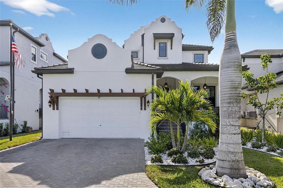 Front exterior of a new home in SouthShore Yacht Club: Somerset Preserve, Ruskin, FL, highlighting curb appeal (Image 27).