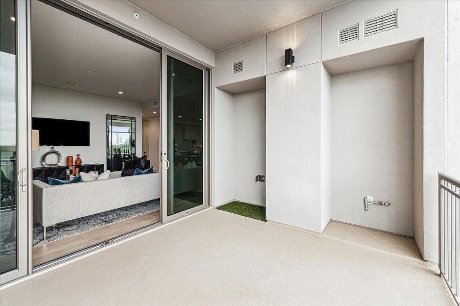 Private balcony opens to living room. Features a pet-pad and Gas connection for a future outdoor grill. Private balcony opens to living room. Features a pet-pad and Gas connection for a future outdoor grill.