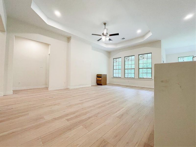 Spacious living room with a view of the backyard